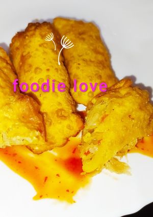 A picture of Mango spring rolls with chilli mango sauce.
