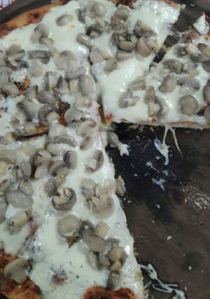 Una foto de Pizza al champiñón