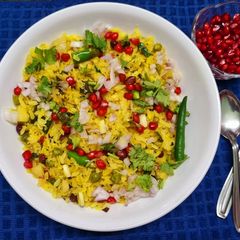 A picture of Poha with Potatoes Peas and Pomegranate.