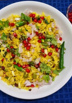 A picture of Poha with Potatoes Peas and Pomegranate.