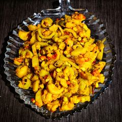 A picture of Spiny gourd and potatoes fry.
