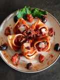 Conchiglioni con ragù di polipo e olive nere
