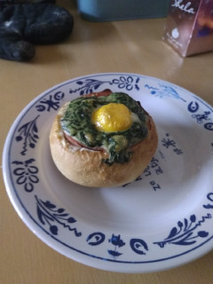 A picture of Creamed spinach and egg bread bowl.