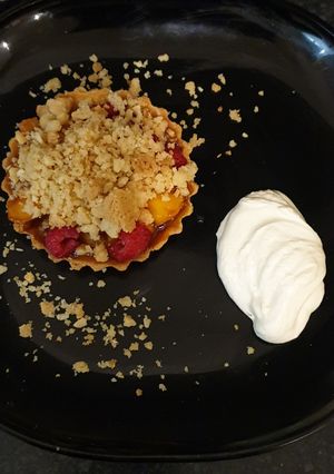 A picture of Nectarine, Raspberry, Polenta and Almond crumble tart.
