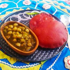 A picture of Healthy chole palak with beetroot bhatura.