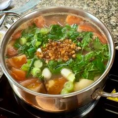 A picture of Cambodian fish and pineapple soup.