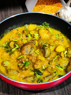 A picture of Chattu aloo besara (mushroom- potatoes cooked in mustard paste).
