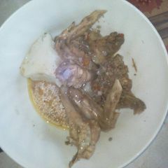 A picture of Wet fried chicken and some ugali.
