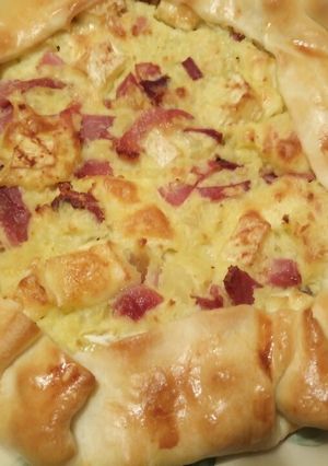A picture of Potato, speck and brie pie.