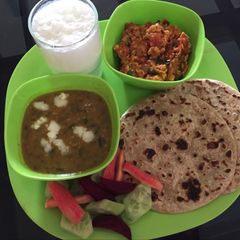 A picture of #Lunch#Paneer Bhurjee with green whole moong dal and chapattis.