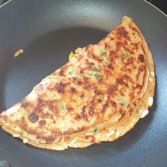 A picture of Vegetable crepe stuffed with mozzarella.