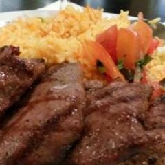 A picture of Grilled beef and fried rice.