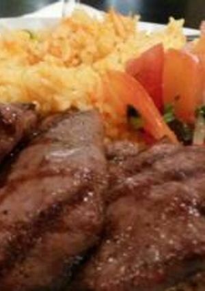 A picture of Grilled beef and fried rice.