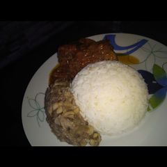 A picture of Rice, beans and stew.