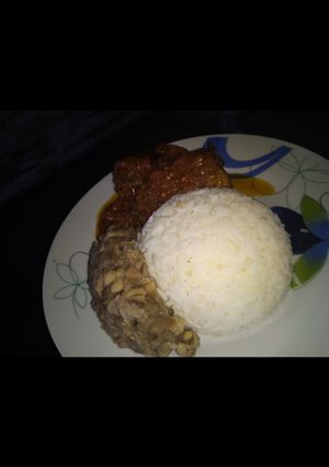 A picture of Rice, beans and stew.