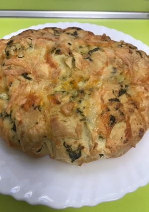 Una foto de Pan de ajo con leche