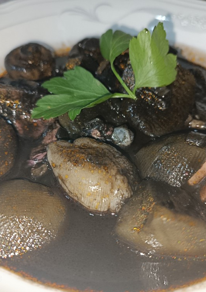 Una foto de Pulpo de playa guisado en su tinta