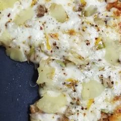 A picture of Pizza with pineapple chunks by azmat #eid k pakwan.