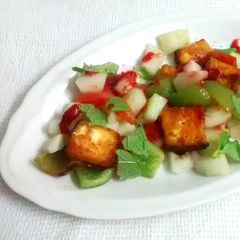 A picture of Grilled Paneer and vegetable salad with strawberry puree.