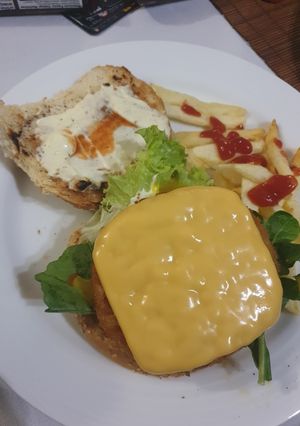 A picture of Veggie Burger and Chips.
