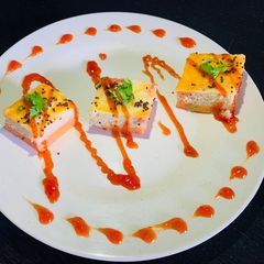 A picture of Multicolored Dhokla.