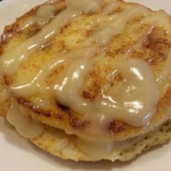 A picture of Cinnamon Roll Pancakes with Cream Cheese Glaze.