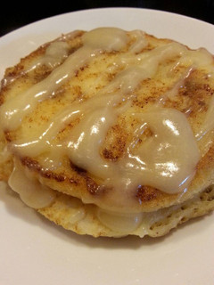 A picture of Cinnamon Roll Pancakes with Cream Cheese Glaze.