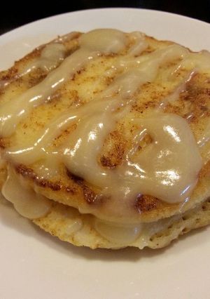 A picture of Cinnamon Roll Pancakes with Cream Cheese Glaze.