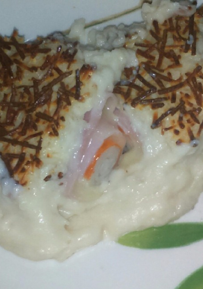Una foto de Rollitos de york, queso y surimi gratinados