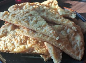 Una foto de Fainá de queso y muzarella