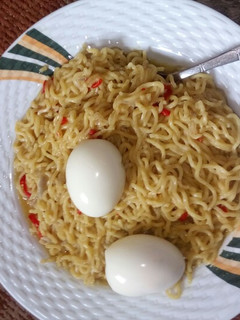 A picture of Noddle's with boiled egg.
