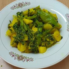 A picture of Malabar Spenich with potatoes,A Classic Bengali Dish.