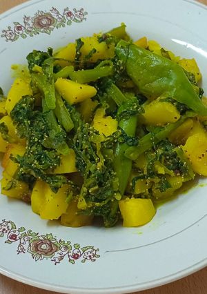 A picture of Malabar Spenich with potatoes,A Classic Bengali Dish.