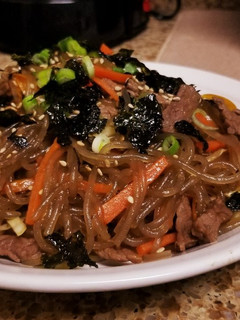 A picture of Japchae (Korean Glass Noodles).