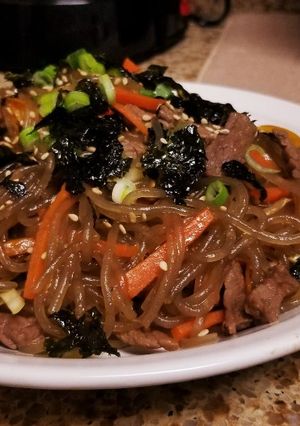 A picture of Japchae (Korean Glass Noodles).