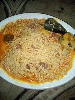 A picture of Spaghetti jollof with fish.
