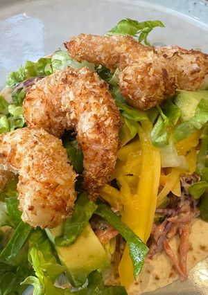 A picture of Crispy Prawn Tacos with Smoky Slaw.