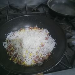 A picture of Sweet con and hot dog fry rice.