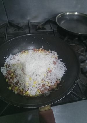 A picture of Sweet con and hot dog fry rice.