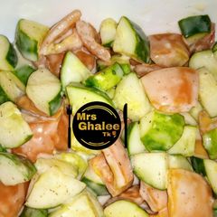 A picture of Tomotoes and cucumber salad.