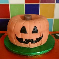 A picture of Vickys Halloween Pumpkin Piñata Cake, Decorating Idea.