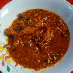 A picture of Fresh tomatoes and okro sauce.
