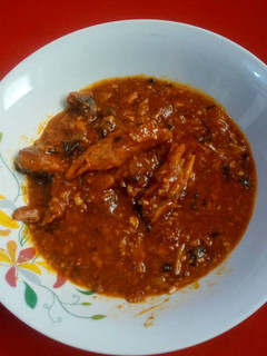 A picture of Fresh tomatoes and okro sauce.