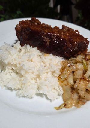 A picture of The BEST Meatloaf with sauteed cabbage.