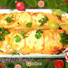 A picture of Trout with lemon and cheese.