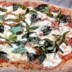 A picture of Fresh mozzarella Basil sourdough pizza.