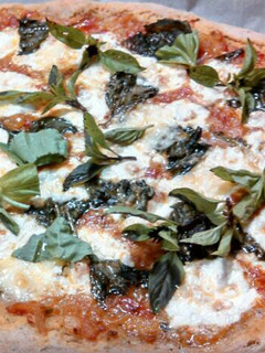 A picture of Fresh mozzarella Basil sourdough pizza.