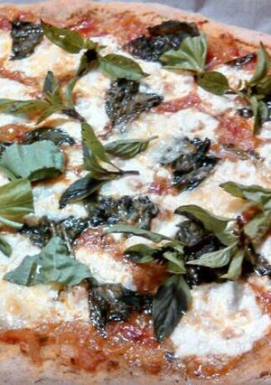 A picture of Fresh mozzarella Basil sourdough pizza.
