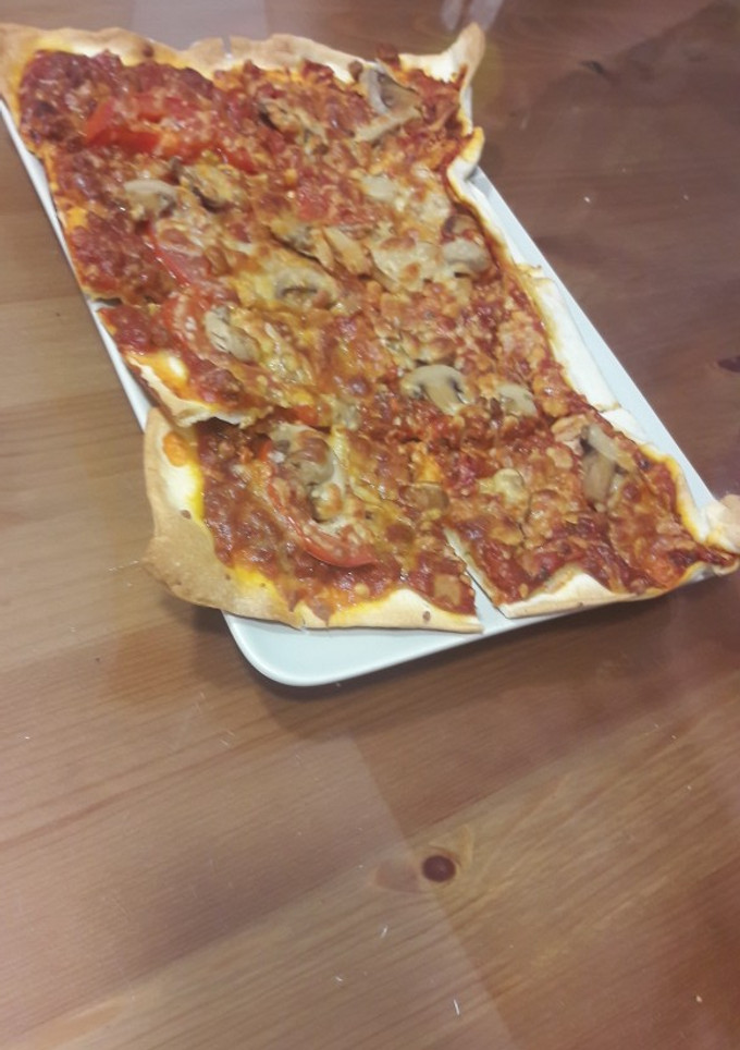 Una foto de Pizza con champiñones
