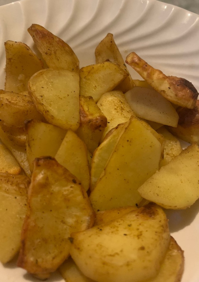 Una foto de Papas condimentadas al horno